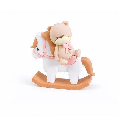 Sleeping teddy bear on rocking horse cake topper pink saddle