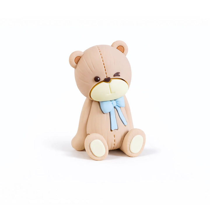 Winking teddy bear cake topper with blue bow