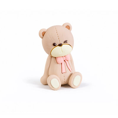 Winking teddy bear cake topper with pink bow