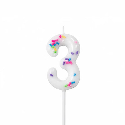 White number 3 birthday candle with colorful sprinkles