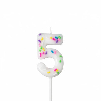 White number 5 birthday candle with colorful sprinkles