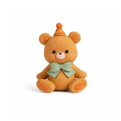 Teddy bear cake topper with orange party hat and green bow tie